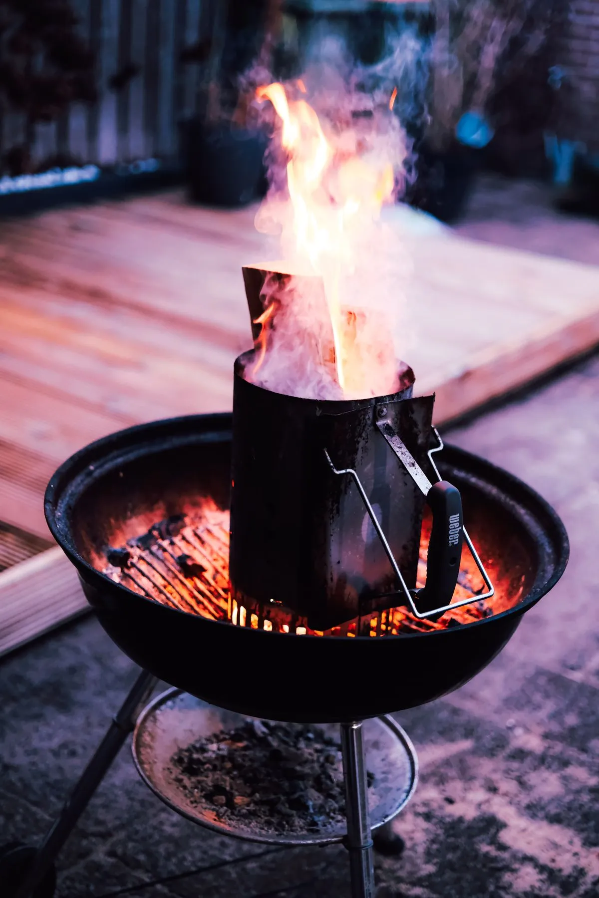 Flames rising from a charcoal grill